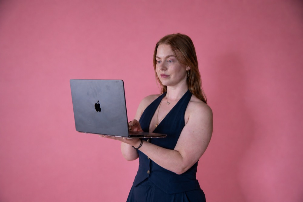 Harriet, founder of Ooco, with her laptop